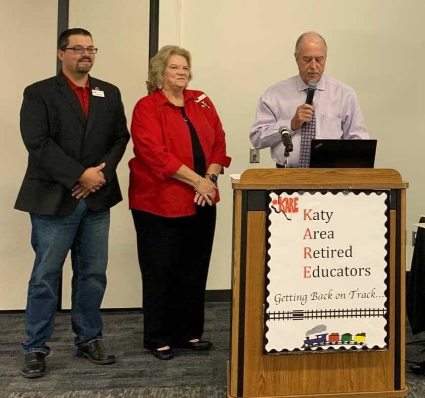 Katy Mayor Bill Hastings (at podium) reads a declaration in honor of the Katy Area Retired Educators’ twentieth anniversary while Mayor Pro Tem Chris Harris (left) and KARE President Earlene Hopkins (center) listen. KARE was founded in 2001 with the mission to support retirees who had worked for educational institutions and students within Katy ISD.